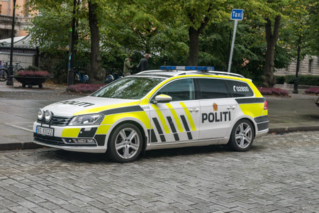 Oslo, Norway - September 24, 2021: Norwegian police (Politi) car Volkswagen parked in city center of...