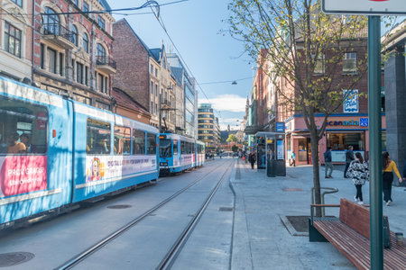 Oslo, Norway - September 25, 2021: Tram stop with blue trams of public transport of Oslo.のeditorial素材