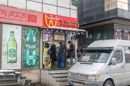 Kutaisi, Georgia - March 18, 2022: Shawarma restaurant. Restaurant with similar logo to upside down...