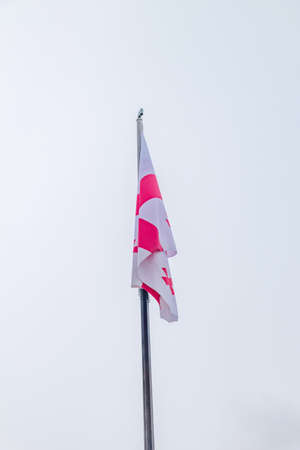Flag of Georgia (country) on flagpole.の写真素材