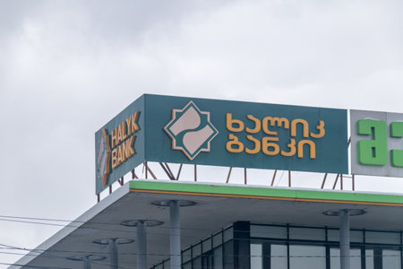 Kutaisi, Georgia - March 18, 2022: Logo and sign of Halyk Bank.のeditorial素材
