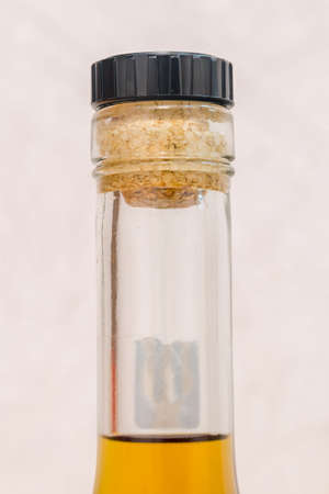 Detail of spirit bottle with cork. Close Up on cork inide bottle neck.