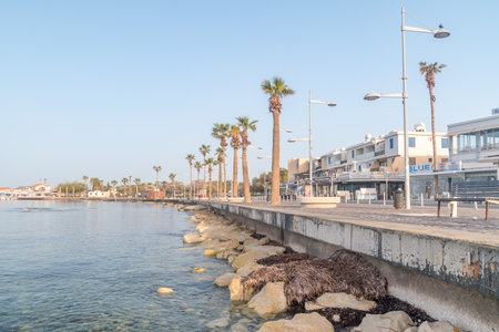 Paphos, Cyprus - April 2, 2022: City promenade on mediterranean seashore.のeditorial素材