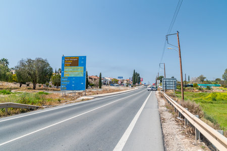 Peyia, Cyprus - April 2, 2022: Entrance road to Peyia city.のeditorial素材