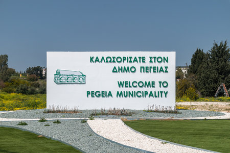Peyia, Cyprus - April 2, 2022: Entrance sign to Pegeia (Peyia) municipality.のeditorial素材