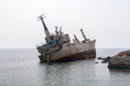Peyia, Cyprus - April 2, 2022: Abandoned Edro III Shipwreck at seashore of Peyia.のeditorial素材