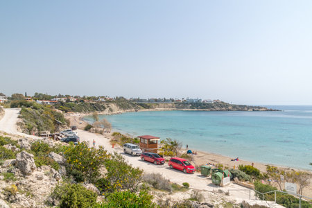 Peyia, Cyprus - April 2, 2022: Panoramic view of Sandy beach of Coral Bay at sunny day.のeditorial素材