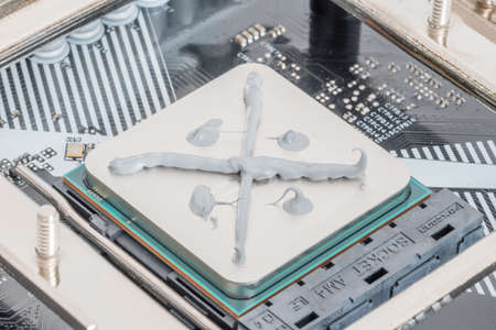 Pruszcz Gdanski, Poland - April 21, 2022: Thermal paste on AMD Ryzen 7 5700G CPU in AM4 socket on motherboard.のeditorial素材