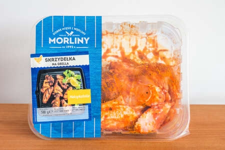 Pruszcz Gdanski, Poland - May 18, 2022: Pack of Morliny chicken wings in mexican sauce.のeditorial素材