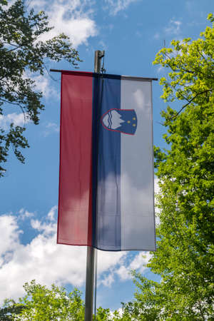 National flag of Slovenia at Tromejnik, 3-national-border site (Slovenia, Austria, Hungary). Border of three countries in Europe's Schengen Area.の写真素材