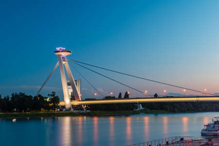 Bratislava, Slovakia - May 31, 2022: Bratislava SNP bridge with UFO observation point at night.のeditorial素材