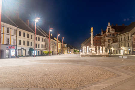 Maribor, Slovenia - June 2, 2022: Maribor Town's Main Square (Glavni trg) with Plague Column at night.のeditorial素材