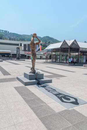Sarajevo, Bosnia and Herzegovina - June 3, 2022: Delibasic's statue in front of the Mirza Delibasic Hall in Sarajevo.のeditorial素材
