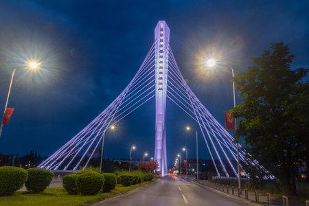 Podgorica, Montenegro - June 4, 2022: Illuminated Millennium Bridge at night.のeditorial素材