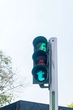 Green pedestrian traffic light in capital of Albania.の写真素材