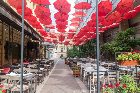 Belgrade, Serbia - June 7, 2022: Red umbrellas above Manufaktura Restaurant Belgrade.のeditorial素材