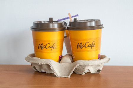 Pruszcz Gdanski, Poland - November 27, 2022: Two cups of McDonald McCafe. Yellow cup of coffee from McDonald'sのeditorial素材