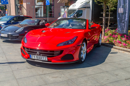 Bydgoszcz, Poland - July9, 2023: Red Ferrari car at Enea Bydgoszcz Triathlon.のeditorial素材