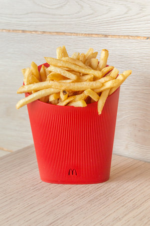 Assevillers, France - August 5, 2023: McDonald's french fries in ecological reusable plastic cups.のeditorial素材