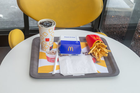 Saint-Ghislain, Belgium - August 6, 2023: McDonald's Royal o fish burger, Coca-Cola and french fries.のeditorial素材