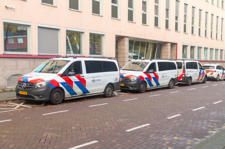 Rotterdam, Nederland - October 22, 2023: Nederlands Police (Politie) cars at police station in city center of Rotterdam.のeditorial素材