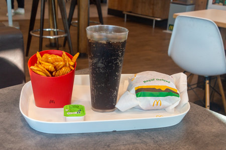 Castets, France - November 19, 2023: McDonald's meal with Royal Deluxe burger, Coca-Cola and potato...