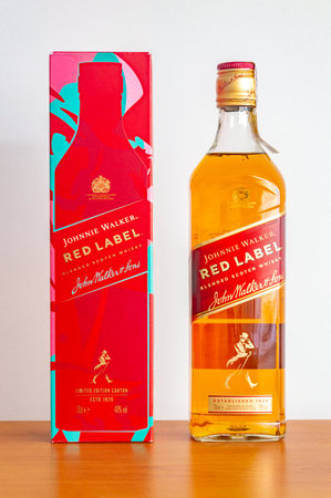 Pruszcz Gdanski - December 24, 2023: Box and bottle of Johnnie Walker Red Label scotch whiskey.のeditorial素材