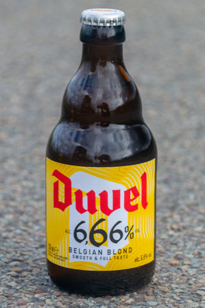 Antwerp, Belgium - February 24, 2024: Bottle of Duvel Belgian blond smooth and full taste beer.のeditorial素材
