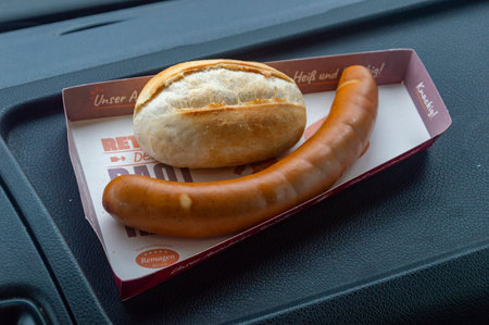 Wendeburg, Germany - February 27, 2024: German Bockwurst sausage with roll. Bockwurst from gas station.のeditorial素材