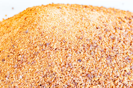 Macro photo of Coconut sugar. Detail of coco sugar also known as coconut palm sugar or coco sap sugar.の写真素材