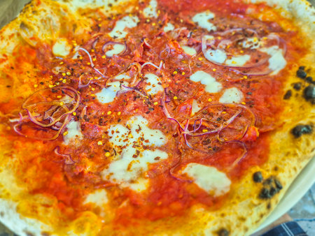 Detail of Neapolitan pizza with spicy salami.の写真素材