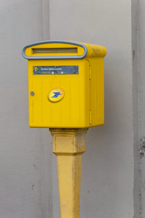 Le Havre, France - January 31, 2026: Yellow post box of La Poste.