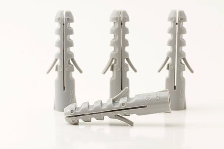 eon rawlplug lies in front of three rawlplugsの写真素材