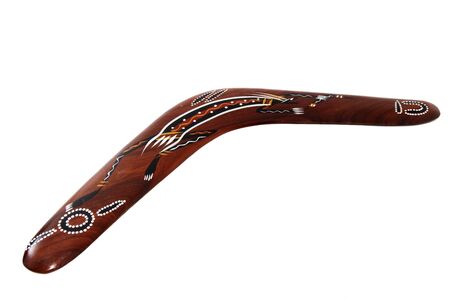 one brown handmade boomerang on white backgroundの写真素材