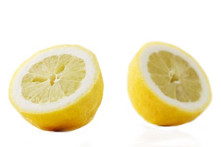 focus on one half lemon in front of another half lemonの写真素材