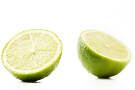 two half limes on white backgroundの写真素材