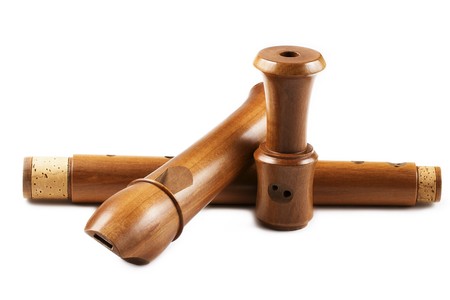 treble flute in three parts on white backgroundの写真素材