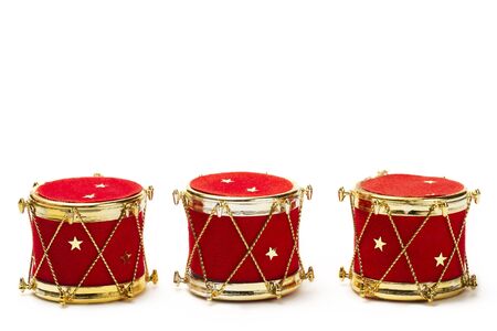 three christmas ball ornaments in drum shape on white backgroundの写真素材