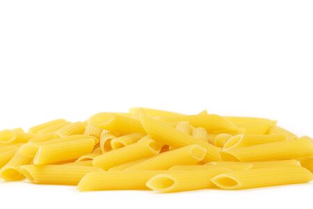 some raw penne rigate on white backgroundの写真素材