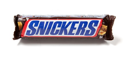 Toronto, Canada - May 8, 2012: This is a studio shot of a Snickers candy bar made by Mars, Incorporated isolated on a white background.のeditorial素材