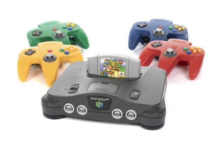 Taipei, Taiwan - February 18, 2018: A studio shot of a Nintendo 64 system with four controllers and...