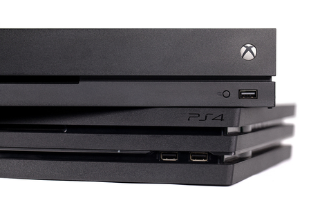 Taipei, Taiwan - December 8, 2018: A studio shot of Sony's Playstation 4 Pro and Microsoft's XBOX...