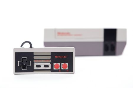 Taipei, Taiwan - May 1, 2019: The Nintendo Entertainment System and controller isolated on whiteのeditorial素材