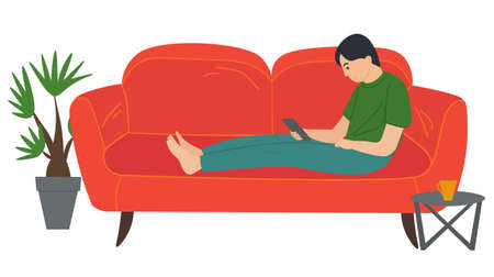 A man lying on the sofa, holding a smartphone. Relaxing at home concept vector flat design. Cheerful man is sitting on couch and is holding phone in hand. Rest time, leisure, free time after workのイラスト素材