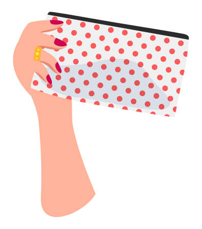 Isolated at white background white female hand with red nail polish, golden ring on finger holding dotted cosmetic bag with silhouette of cosmetics inside. Equipment of visagiste. Simple iconのイラスト素材