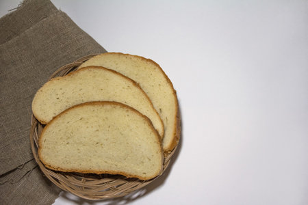 Bread slices on the canvas cloth and white background. High quality photo