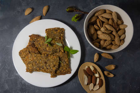 Whole grain homemade crispbread and almonds. Healthy lifestyle breakfast. High quality photoの写真素材