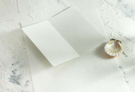 Modern stationery still life with warm sunlight. Closeup sunny foto of blank card mock-up.の写真素材