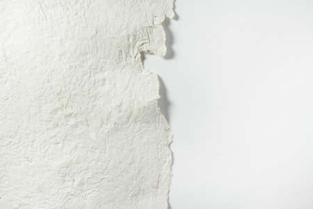 Modern stationery still life with craft hand made rough textured empty paper and white background. Closeup foto of blank card mock-up.の写真素材