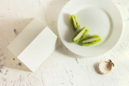 Modern stationery still life with warm sunlight. Closeup sunny foto of blank card mock-up.の写真素材